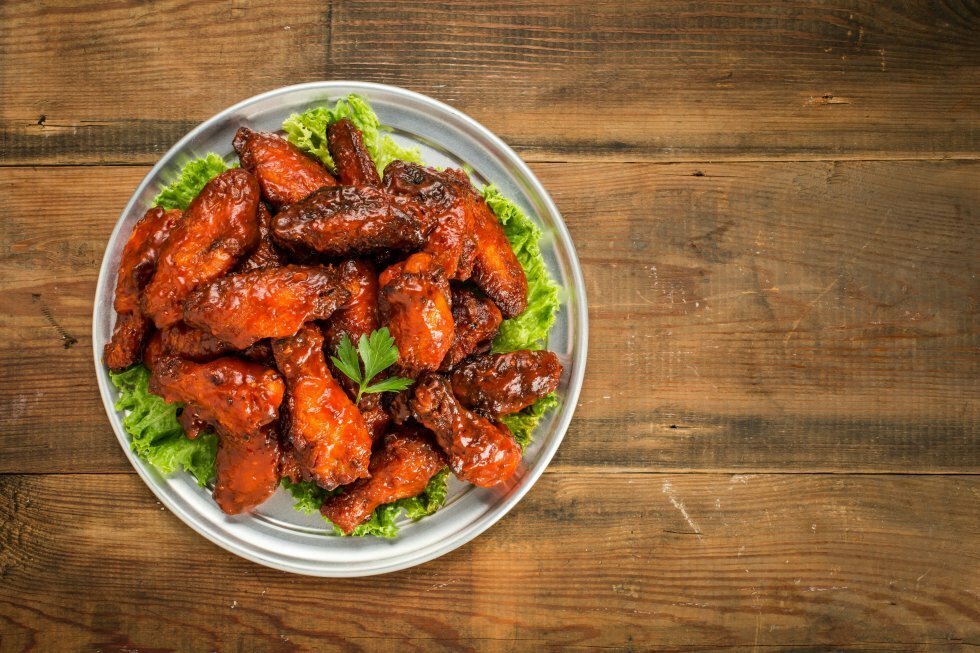 Den ikoniske kæde, der opfandt termen "boneless wings"